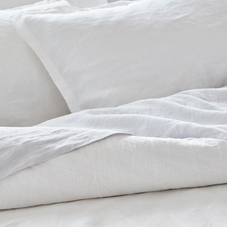 Luxurious white linen sheet set by Baksana for California King beds, featuring soft, eco-friendly, and pre-shrunk materials.