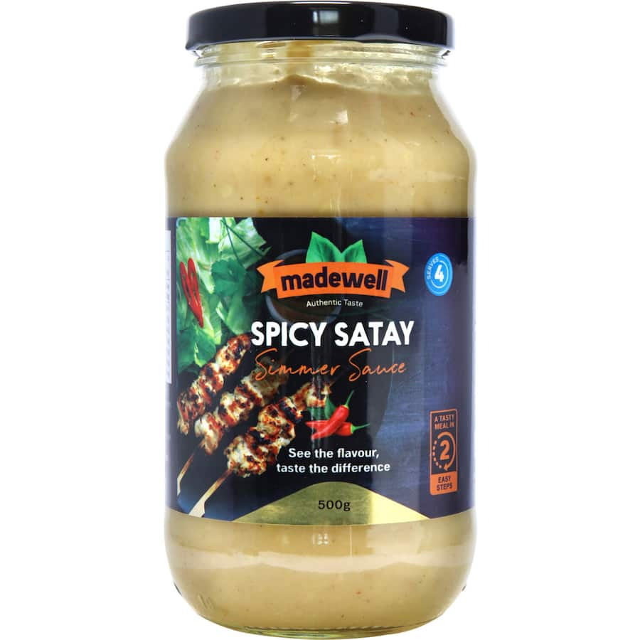 Madewell Meal Base Spicy Satay Simmer Sauce in a jar, showcasing its rich, vibrant color and gourmet appeal.