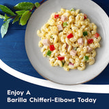 Short, twisted Barilla Pasta Elbows Chifferi in ridged texture, perfect for holding sauces and elevating pasta dishes.