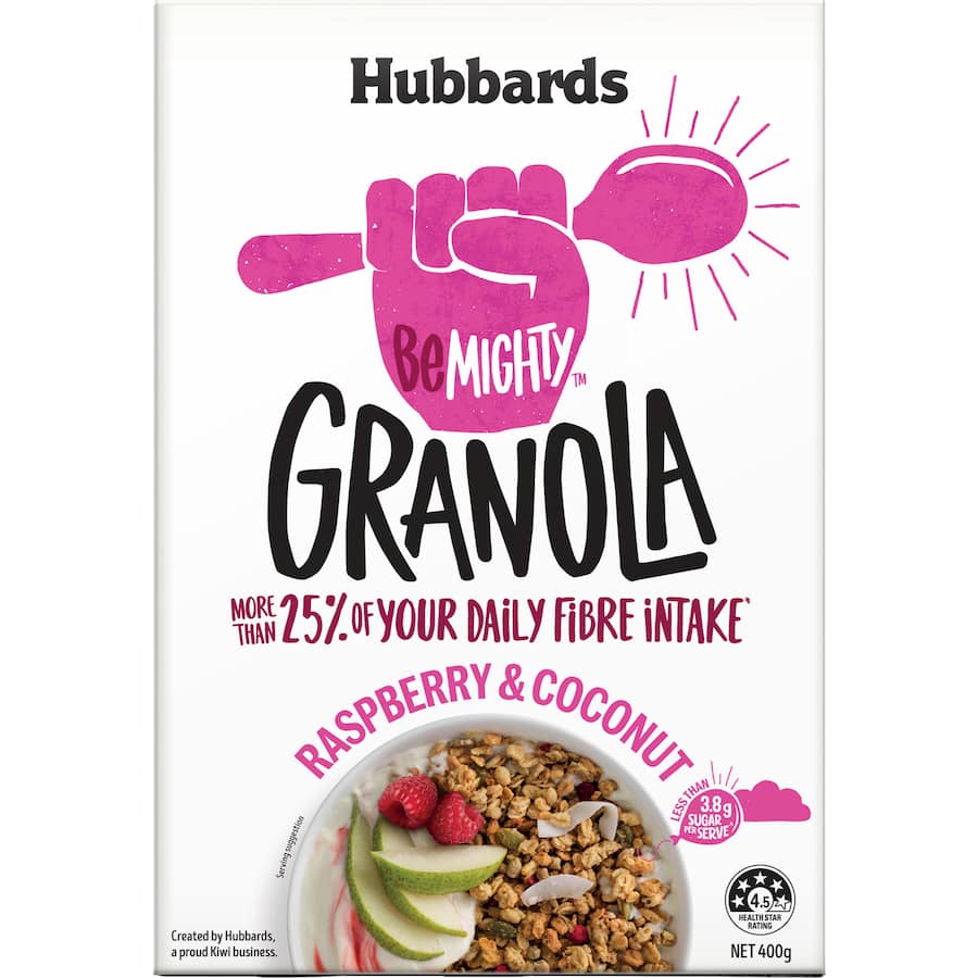 Bowl of Hubbards Be Mighty Granola featuring raspberries and coconut, packed with fiber and low in sugar for a healthy breakfast.