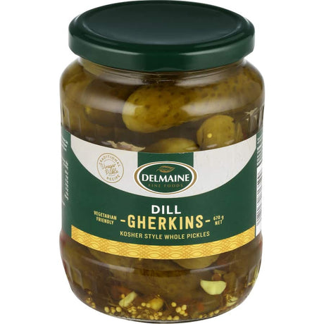 Crispy Delmaine Dill Gherkins infused with garlic and dill, perfect for burgers, sandwiches, or standalone snacking.