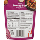 Woolworths Stir Fry Sauce Honey Soy in a bottle, featuring a blend of honey, soy, garlic, ginger, and sesame oil for flavorful meals.