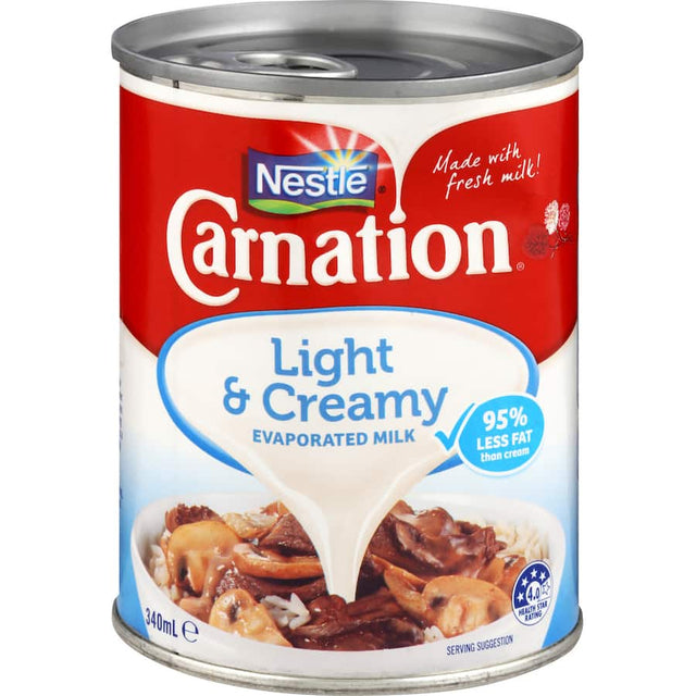 Carnation Light & Creamy Evaporated Milk, low-fat option for enhancing dishes with a rich, creamy texture and delightful flavor.