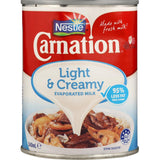 Carnation Evaporated Milk Light & Creamy, a low-fat, concentrated milk for enhancing savory and sweet dishes.