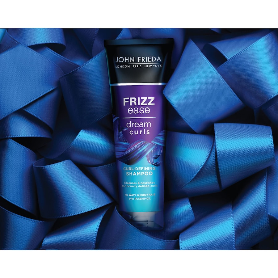 John Frieda Frizz Ease Shampoo Dream Curls for smooth, defined curls with jojoba oil, frizz control, and color-safe formula.