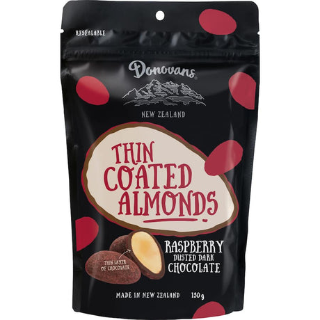 Gourmet chocolate-coated almonds with raspberry dust, offering a perfect blend of flavor and nutrients for snacking.