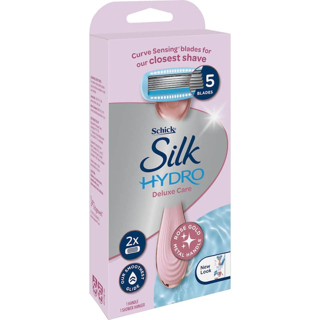 Rose gold Schick Hydro Silk Razor Deluxe with five curve-sensing blades and hydra-boost serum for smooth, precise shaving.