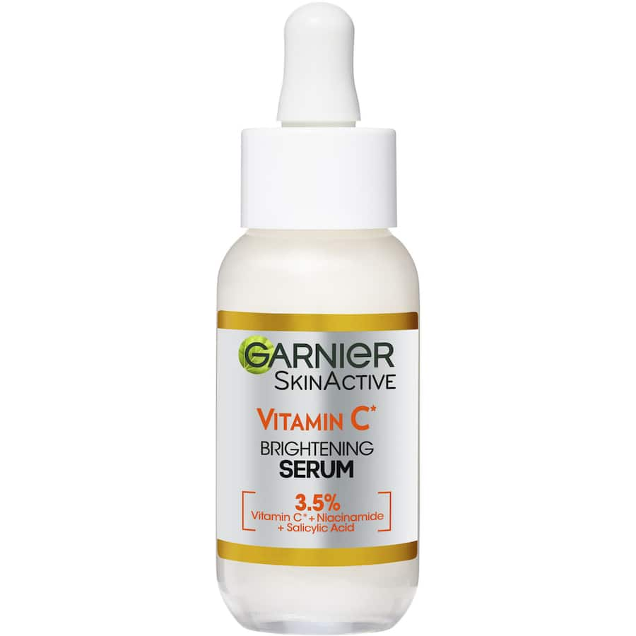 Garnier Skin Active Anti-Dark Spot Serum bottle featuring Vitamin C, Niacinamide, and Salicylic Acid for brighter skin.