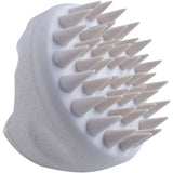 Ergonomic brush for healthy scalp care, promoting circulation and exfoliating for revitalized hair without buildup.