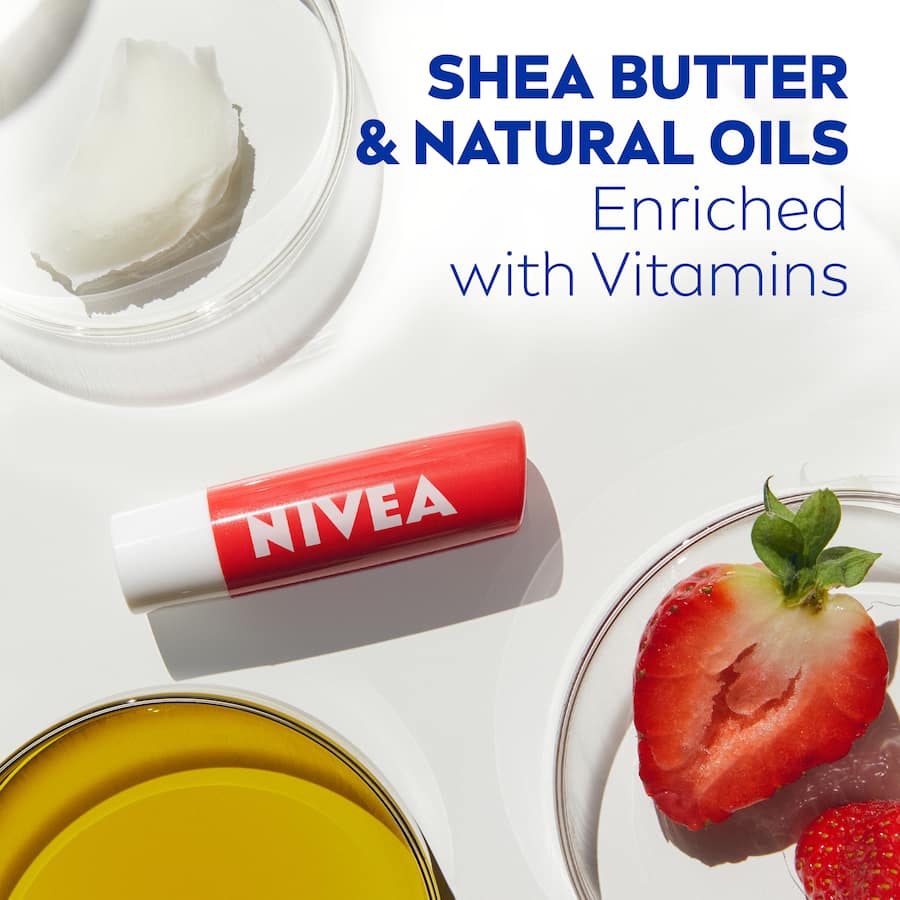 Nivea Fruity Shine Lip Balm Strawberry, 4.8g, providing 24-hour hydration with a sweet strawberry scent and a subtle pink sheen.