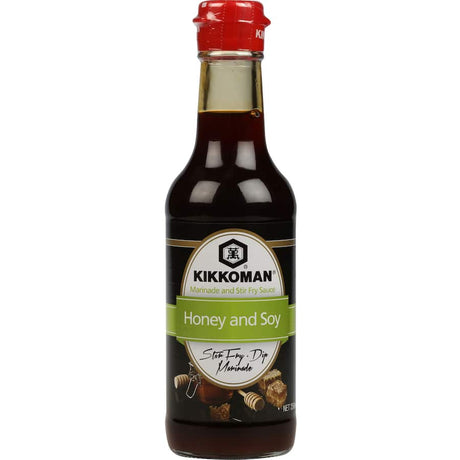 Kikkoman Marinade Honey & Soy bottle showcasing a blend of honey and soy for marinating meats and enhancing flavors.