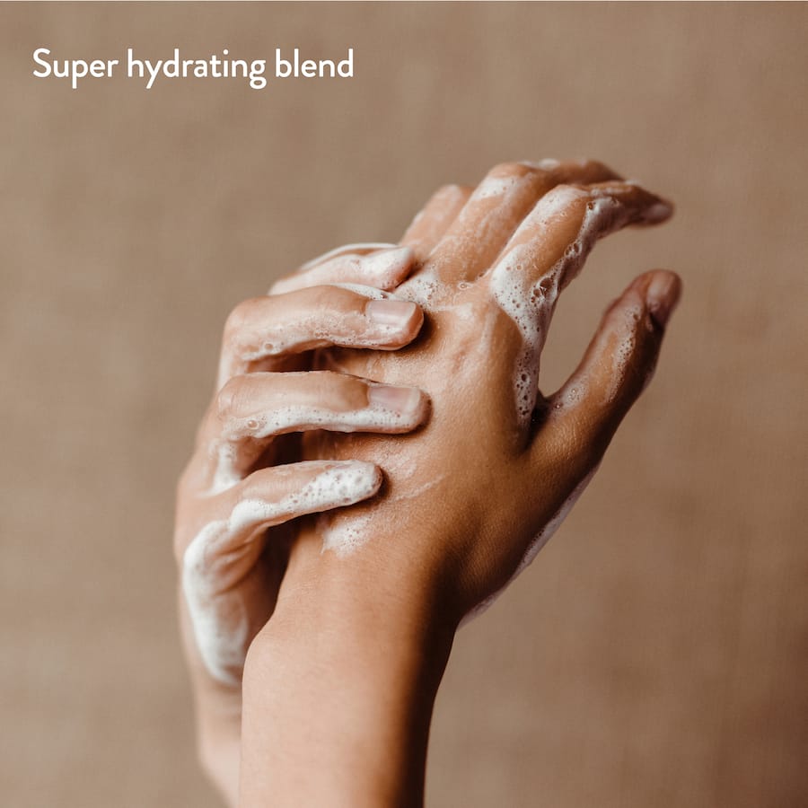 Eco-friendly hand wash refill with coconut and cedar scent, hydrates skin, protects against 99.9% of germs, and sustainable packaging.