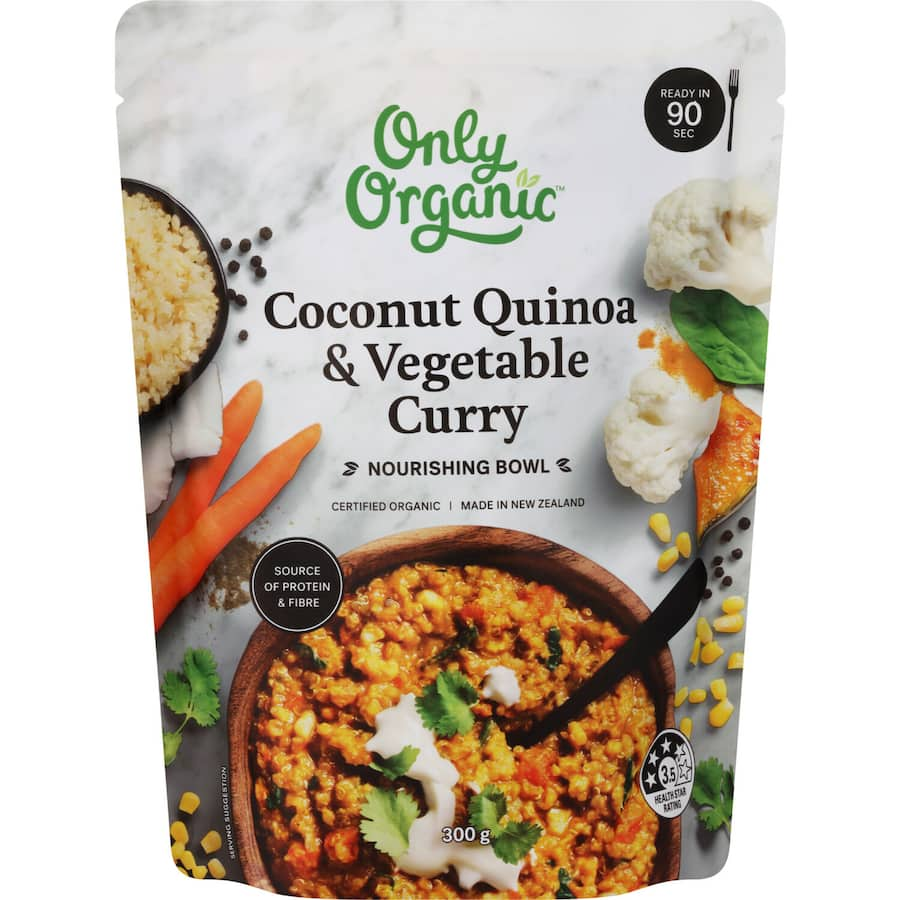 A nourishing bowl of coconut quinoa and vegetables, featuring organic ingredients for a wholesome vegan meal.