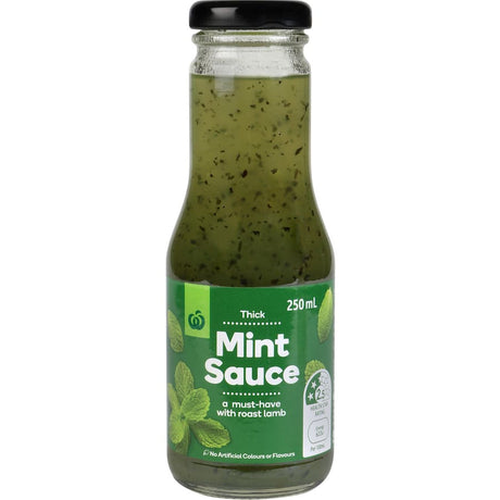 Bottle of Woolworths Mint Sauce Thick, crafted from fresh mint for enhancing roast lamb and savory dishes with robust flavor.