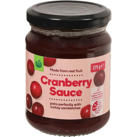 A 275g jar of Woolworths Cranberry Sauce featuring 34% real cranberries, perfect for festive meals and everyday flavors.