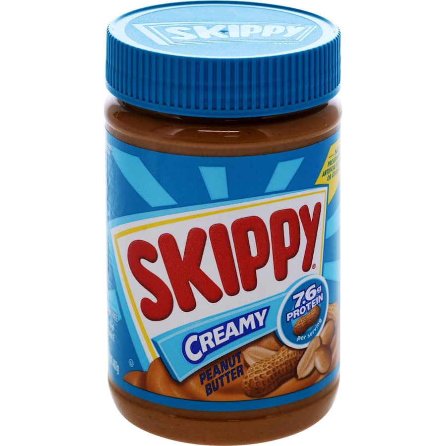 Creamy Skippy Peanut Butter in a jar, perfect for spreading on toast and enriching smoothies, rich in protein and nutrients.