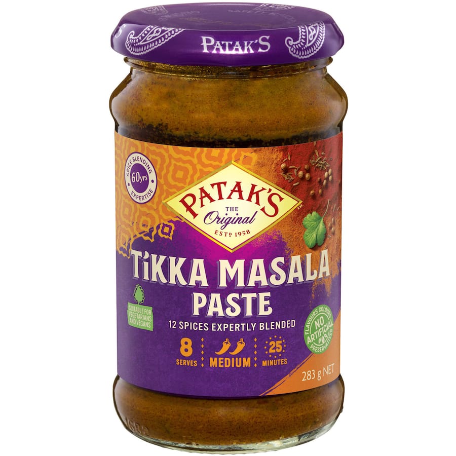 A jar of Patak's Tikka Masala Paste, featuring a blend of 12 aromatic spices, perfect for making flavorful curries.