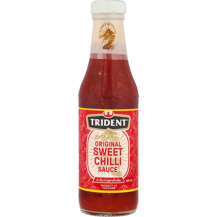 Trident Sweet Chilli Sauce bottle showcasing its authentic Thai recipe, perfect for enhancing meats and seafood.