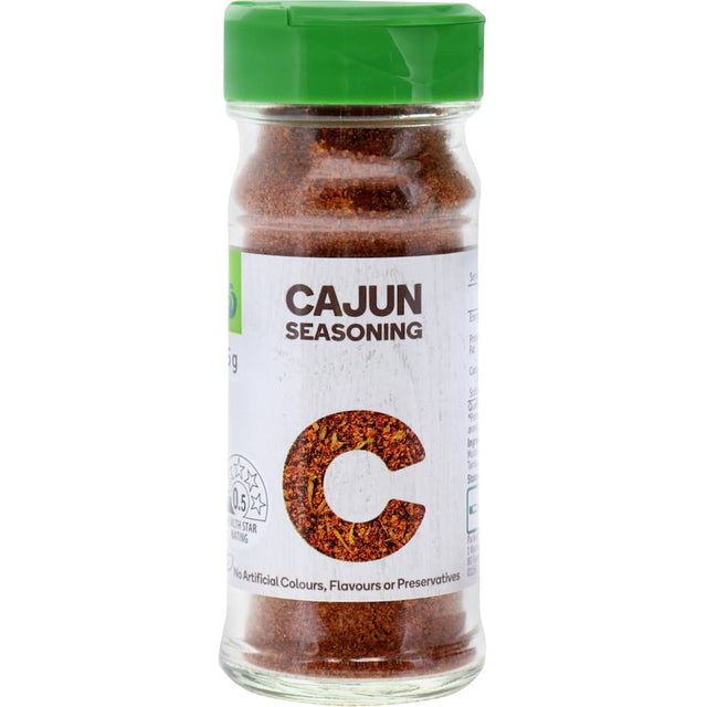 Woolworths Cajun Seasoning jar showcasing a fiery blend perfect for spicing up meats and vegetables, free from additives.