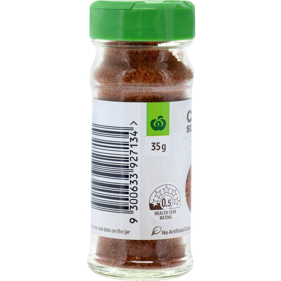 Woolworths Cajun Seasoning bottle featuring a vibrant design, ideal for adding spicy flavor to meats and vegetables.