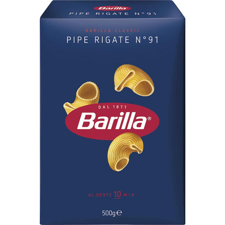 Curved Barilla Pipe Rigate No. 91 pasta, ideal for capturing sauces, perfect for vibrant Italian dishes and quick pasta salads.