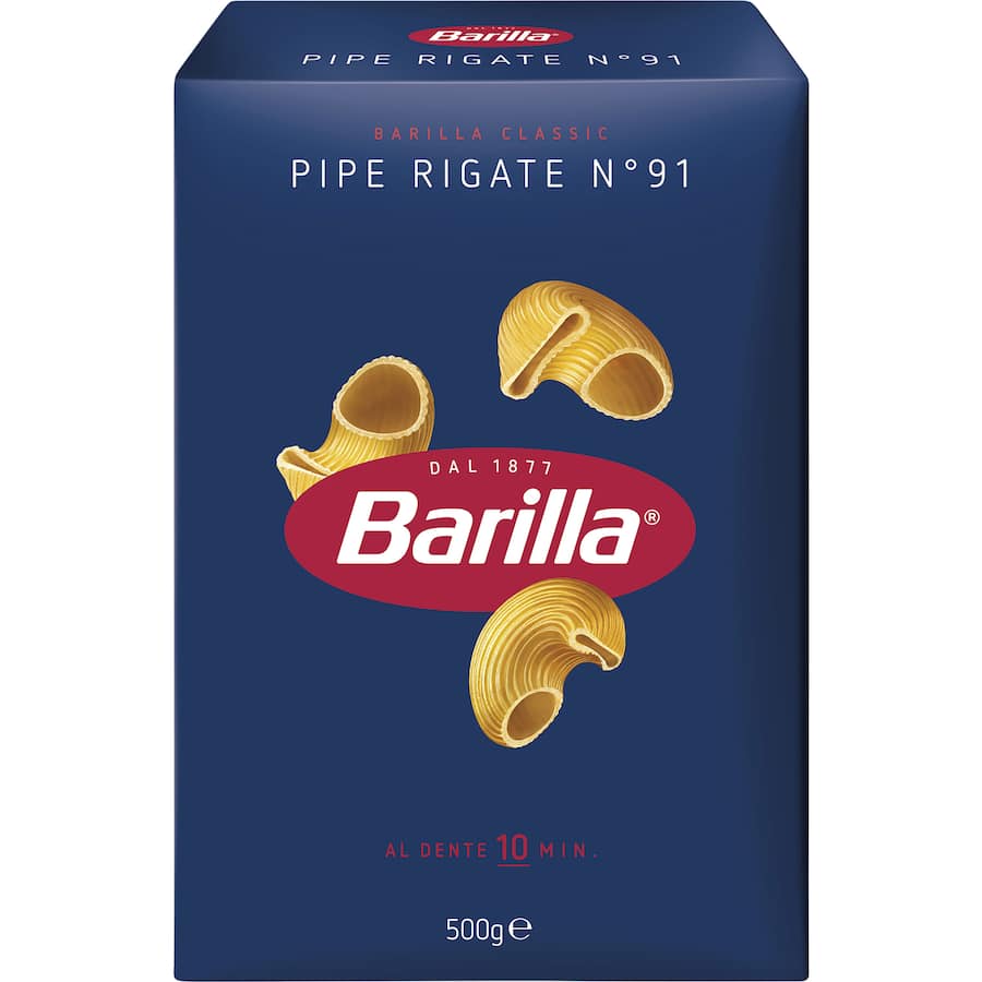 Curved Barilla Pasta Pipe Rigate No. 91, perfect for capturing sauces and enhancing Italian dishes with its unique shape.