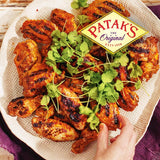 A jar of Patak's Tandoori Paste Marinade, featuring a blend of 8 aromatic spices for authentic Indian dishes.