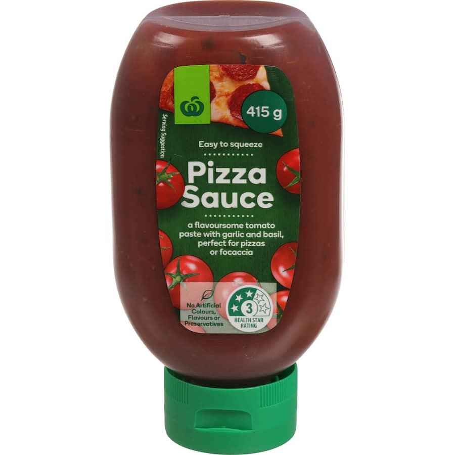 Woolworths Garlic & Basil Pizza Sauce in a squeeze bottle, featuring rich tomatoes, garlic, and basil for gourmet dishes.