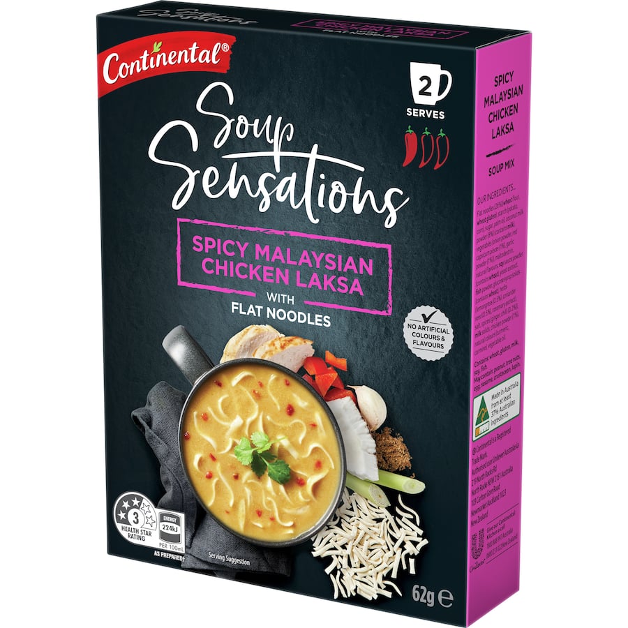 A steaming mug of Continental Chicken Laksa soup, showcasing vibrant spices and rich flavors inspired by Malaysian cuisine.