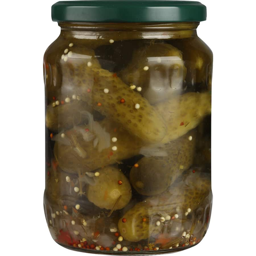 Crunchy Delmaine Whole Gherkins with mustard seeds, perfect for enhancing sandwiches, salads, and gourmet dishes.