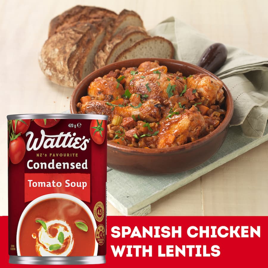 Wattie's Condensed Tomato Soup can, a versatile base for meals, fat-free, with no artificial ingredients, serving vegetables.