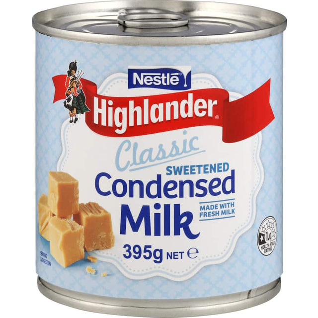 Can of Nestle Highlander Sweetened Condensed Milk, rich and creamy, made with just fresh milk and sugar for delightful desserts.