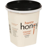 Hantz Creamed Honey in a jar, showcasing its smooth, pale texture, ideal for spreading and enhancing culinary delights.