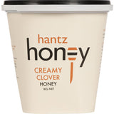 Creamy light-colored clover honey with a mild flavor, perfect as a spread or natural sweetener in dishes and drinks.