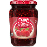 A jar of Craig's Raspberry Fruit Jam, showcasing rich red color, perfect for spreading on toast or pairing with desserts.