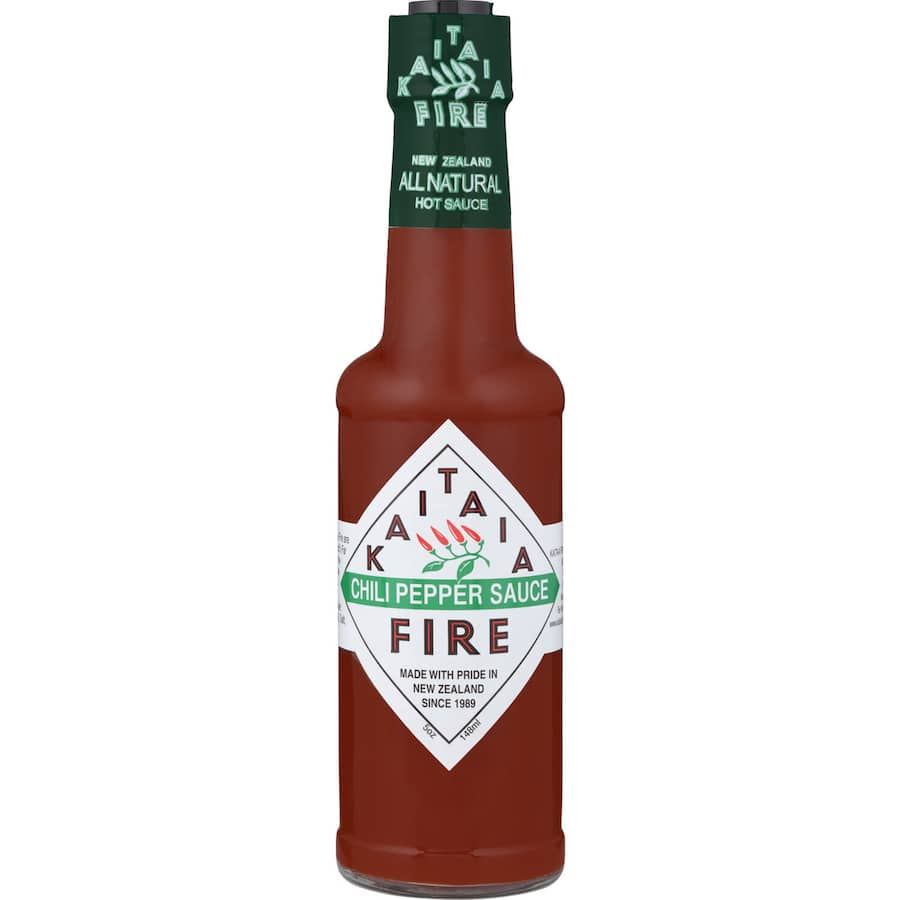 Kaitaia Fire Chili Pepper Sauce, a fiery blend of sun-ripened New Zealand chilies, enhances meals with robust flavor and vitamin C.