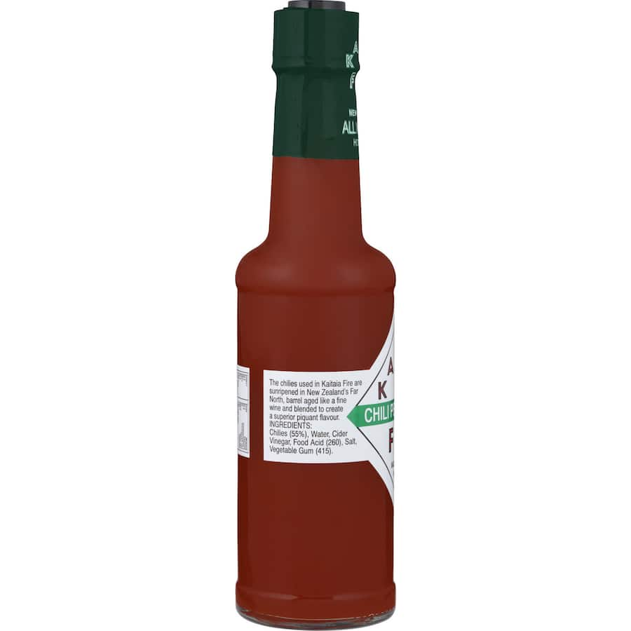 Kaitaia Fire Chili Pepper Sauce bottle showcasing sun-ripened chilies, adding robust flavor and vitamin C to elevate meals.