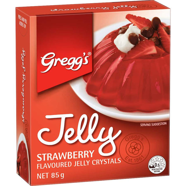 Bright red Greggs Strawberry Jelly crystals ready to mix with boiling water for quick, delicious desserts.