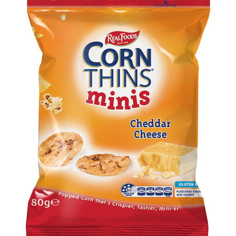 Real Foods Corn Thins Crispbread Cheese Minis - bite-sized, crispy snacks with cheddar flavor, perfect for guilt-free snacking.