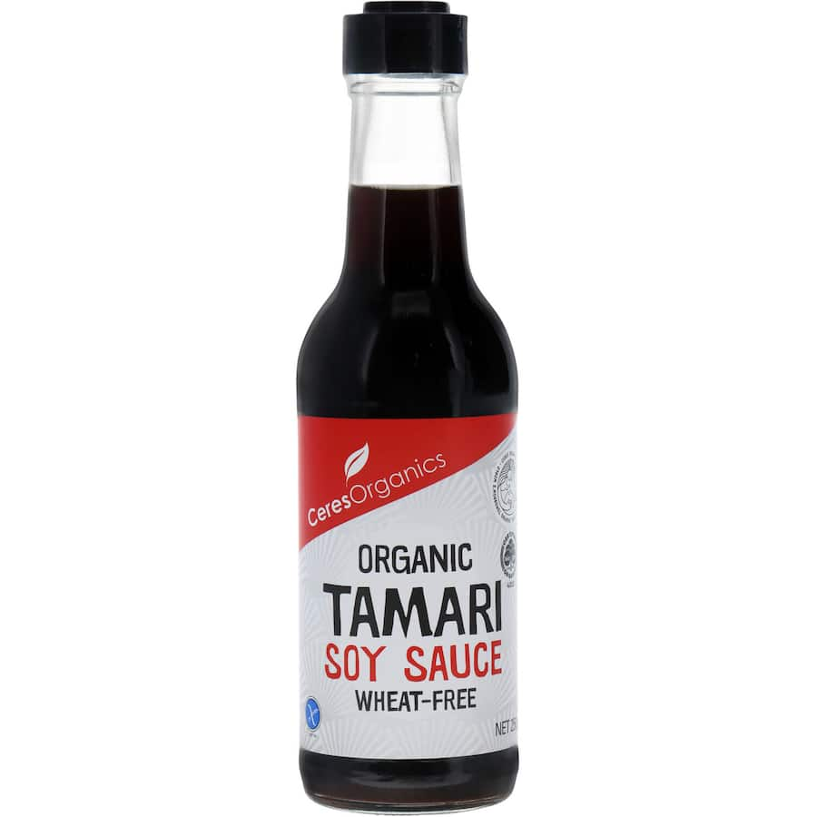 Organic soy sauce tamari in a bottle, rich in umami, wheat-free, and naturally fermented for enhanced flavor.