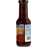 Lone Star BBQ Sauce bottle showcasing its sweet and tangy flavor for grilling meats, gluten-free and all-natural.