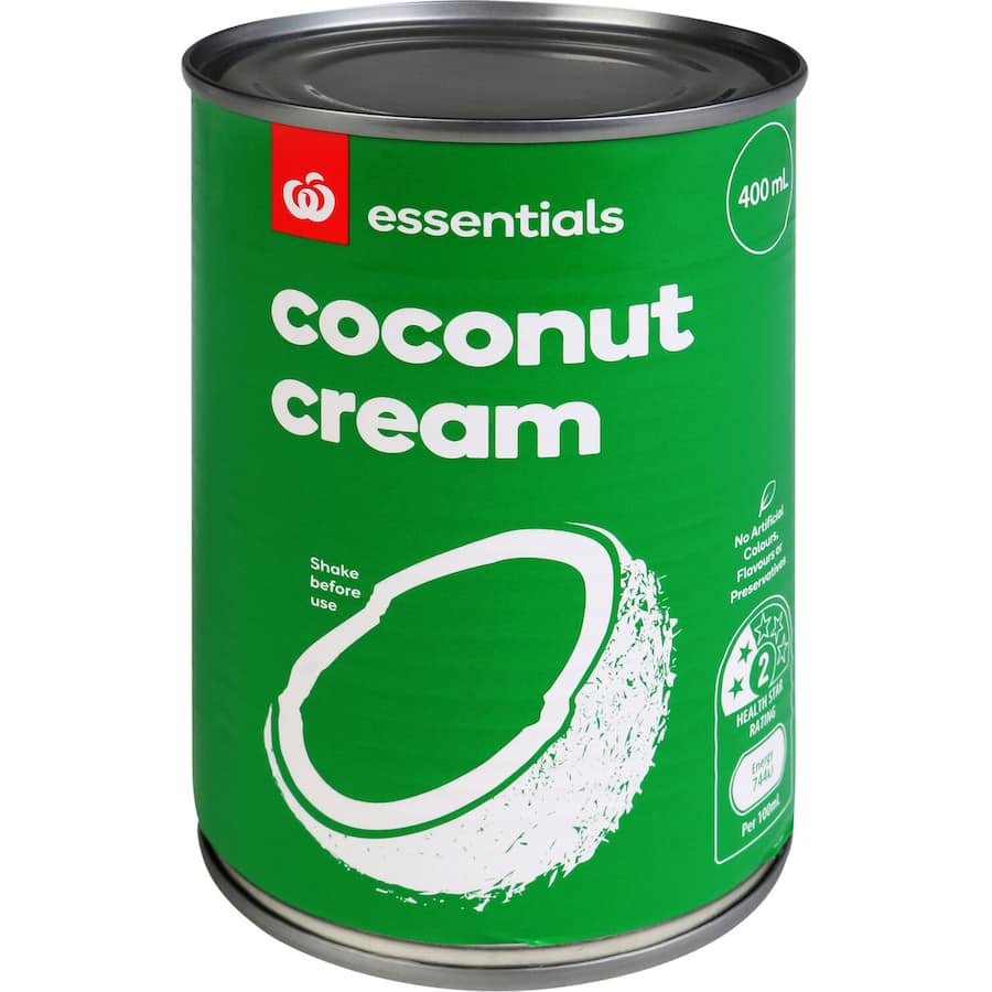A jar of Essentials Coconut Cream, perfect for rich curries and desserts, made from 100% natural coconuts.