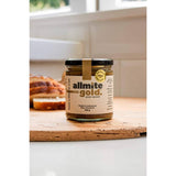 Allmite Gold Yeast Spread: a vegan tahini-based condiment with nutritional yeast, turmeric, and apple cider vinegar for healthy meals.