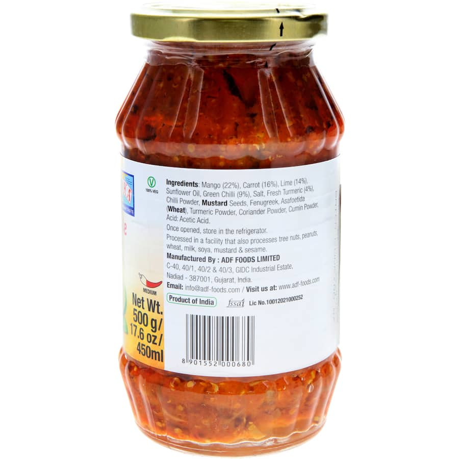 Jar of Ashoka Indian Mixed Pickle featuring colorful vegetables and spices, perfect for enhancing meals with authentic Indian flavor.