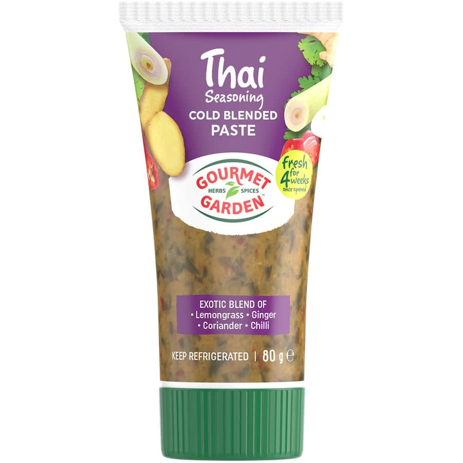 A vibrant jar of Thai herb seasoning featuring lemongrass, ginger, coriander, and chili for authentic dishes.