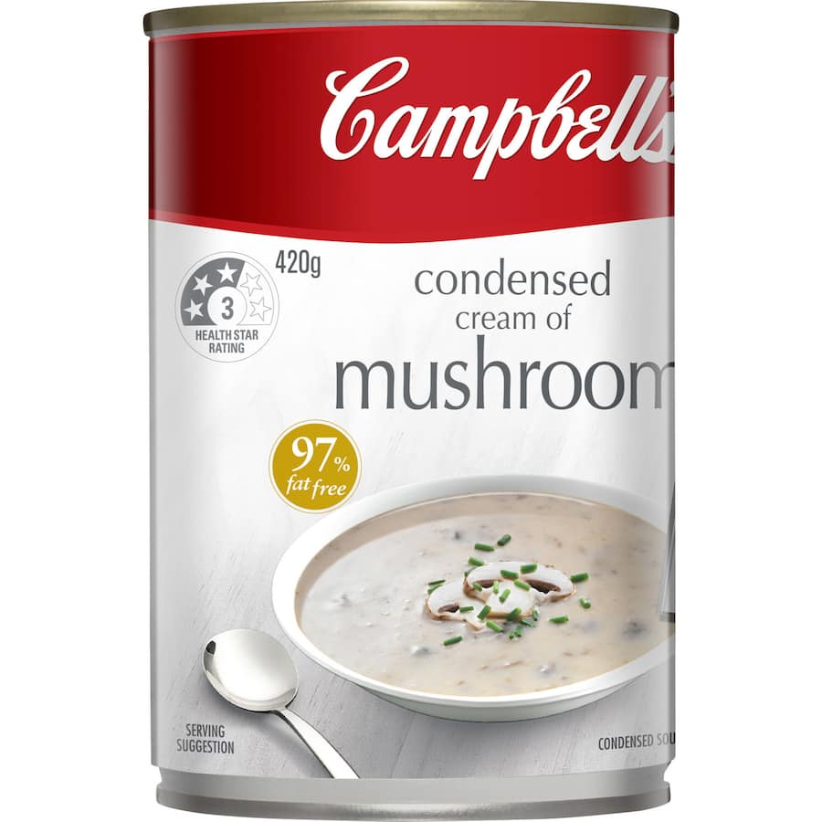 Canned Campbell's Cream of Mushroom Soup, rich and creamy, ideal for versatile dishes or a comforting meal.