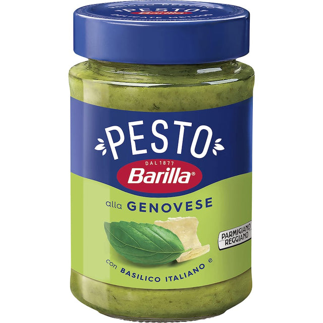 A jar of Barilla Pesto Alla Genovese, featuring creamy basil and Parmigiano Reggiano sauce for enhancing Italian dishes.