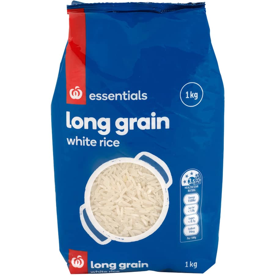 Bowl of fluffy Essentials Long Grain Rice, perfect for enhancing Asian dishes and everyday meals with rich flavor.