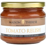 Maison Therese Tomato Relish in a jar, showcasing a thick, chunky blend of tomatoes, onions, and spices for flavorful meals.