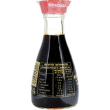 Kikkoman Soy Sauce in a drip-free dispenser, perfect for enhancing dishes with its rich umami flavor and natural brewing process.